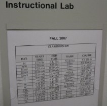 room schedule posted on door